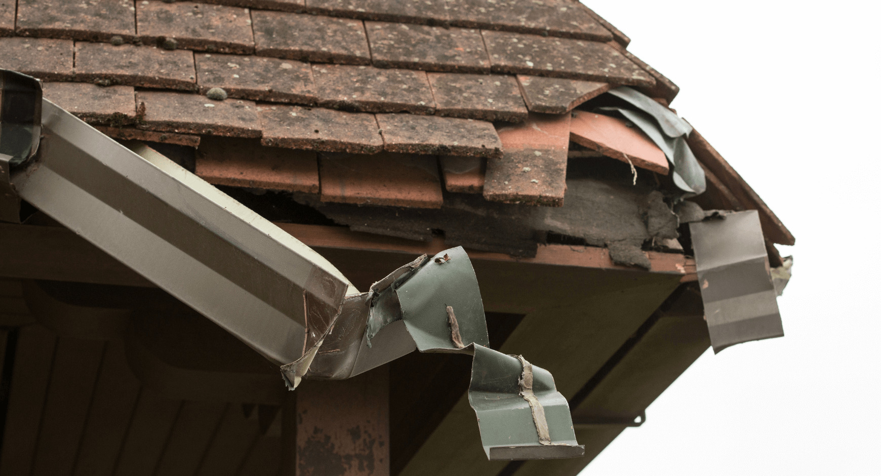 Close-up of a gutter section showing storm damage